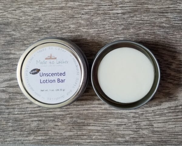 made to lather unscented lotion bar in a tin