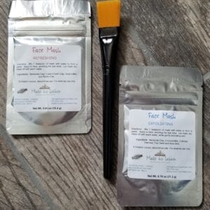 Exfoliating and refreshing face mask packets with an applicator brush